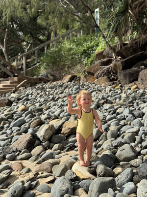 Eco-friendly baby swimwear in retro yellow by Peachy Gang